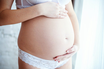 Fototapeta na wymiar Close up of a cute pregnant belly