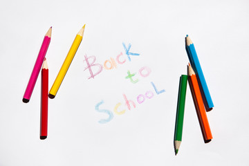 Back to school, words on real paper with pencils