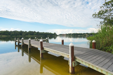 Naklejka premium Peaceful Fishing Pier on Bayou