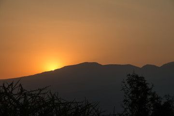Fototapeta na wymiar A golden sunset on a mountain range