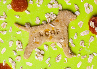 Dried apricots and oat flakes dog biscuits on a cutting board