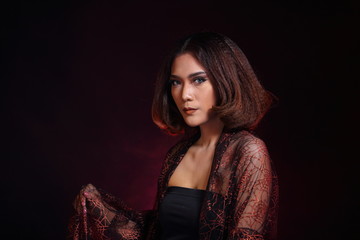 Asian Woman Fashion Make Up brunette hair, studio lighting black background