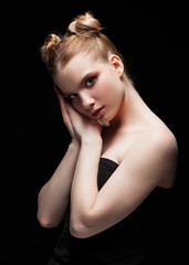 Obraz premium Young teen female beauty low key portrait with day makeup on black