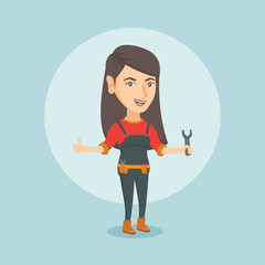 Young smiling repairman standing with a spanner in hand. Caucasian female repairman giving thumb up. Female repairman in overalls holding a spanner. Vector cartoon illustration. Square layout.