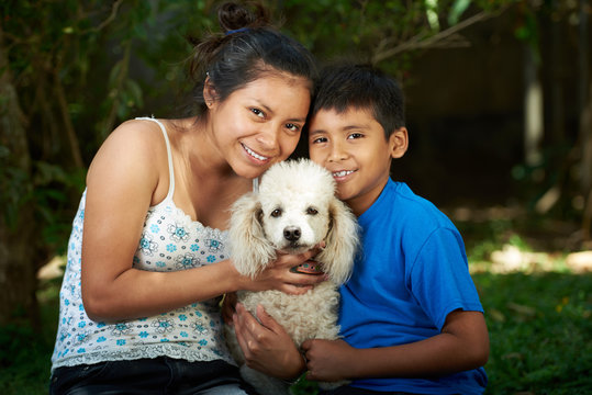 Boy And Girl With Poodle Dog