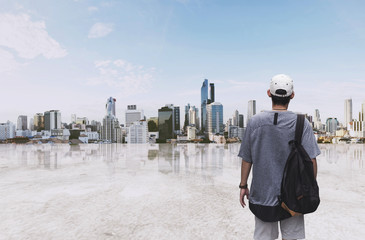 a man with backpack standing at sightseeing city view in the morning © SasinParaksa