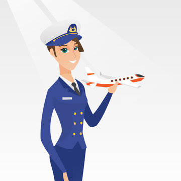 Young Caucasian Airline Pilot Holding The Model Of Airplane In Hand. Cheerful Female Airline Pilot In Uniform. Smiling Pilot With The Model Of Airplane. Vector Cartoon Illustration. Square Layout.