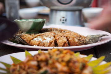 Fish fry in a plate on the table.