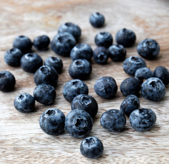 Blueberry on wooden table background.