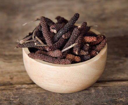 Long pepper or Piper longum on wooden table