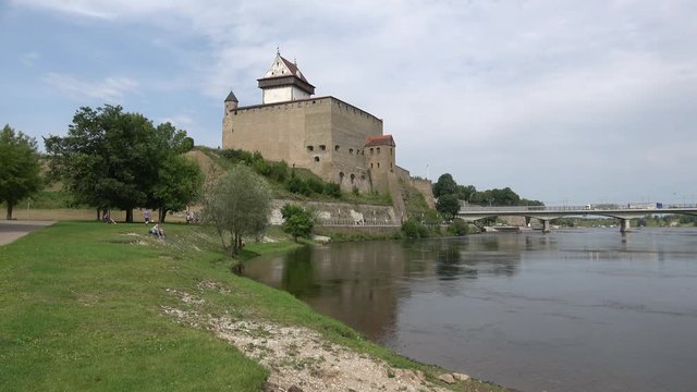 The castle Herman on the banks of the Narva river, day in august. Estonia