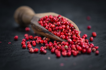 Rustic slate slab with Pink Peppercorns, selective focus