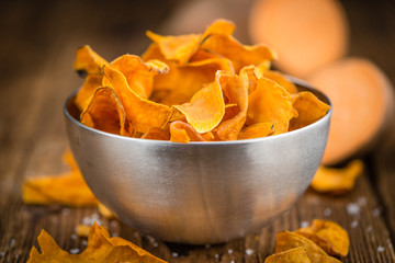 Fresh made Sweet Potato Chips on a rustic background