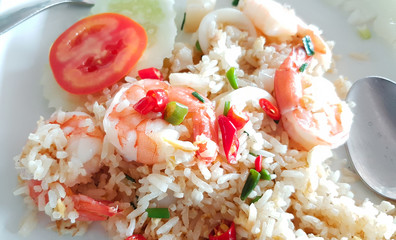 Fried rice with shrimp on white square tile plate