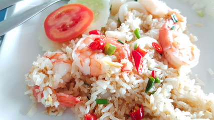 Fried rice with shrimp on white square tile plate