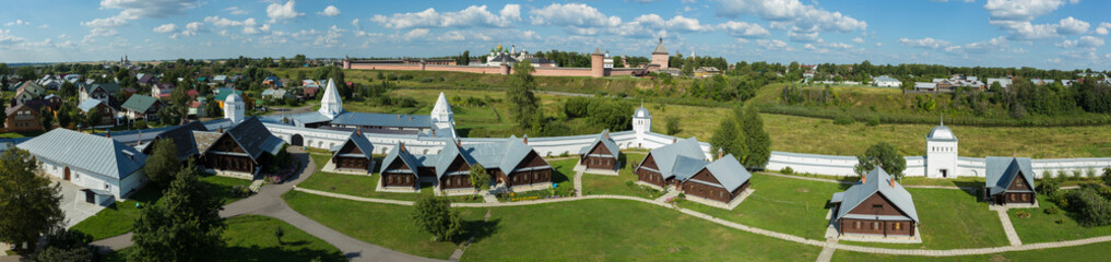 Fototapeta na wymiar Super wide panorama of Suzdal with cells of the Pokrovsky monastery (foreground) and the Spaso-Evfimiev monastery (background)