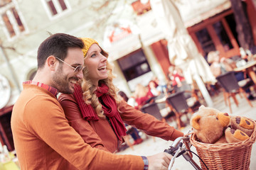 Couple with bicycles in the city.