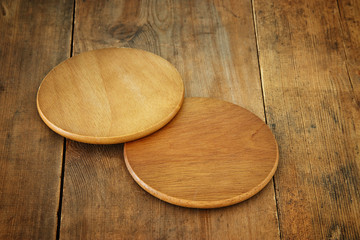 image of wooden beer coasters on textured table background