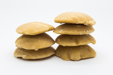 Stack hard palm sugar on white background