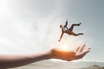 Fototapeta premium Hand of help and protection . Mixed media