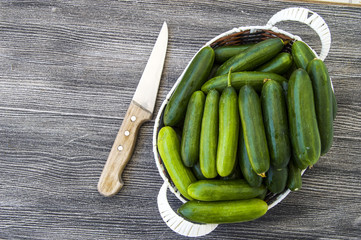 Fresh cucumber pictures on a white background, natural and organic cucumbers, cucumber pictures cut with a knife in a basket
