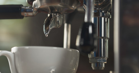 last drop water rinse professional coffee machine into cappuccino cup