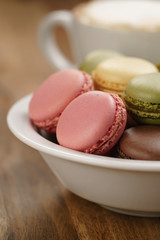 mixed macarons in bowl closeup shot