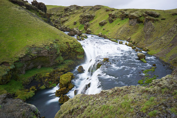 Fototapeta na wymiar Mountain view of Skogarfoss waterfall, Iceland.