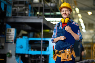 Smiling Female Worker at Factory