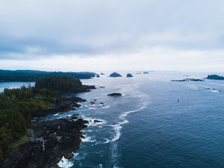 Fototapeta na wymiar Aerial shot of waves hitting rocks on ocean coast