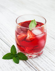 Glass of lemonade with strawberries