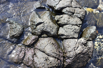 Stones on the beach at the sea under water