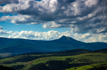 Naklejka na ściany i meble Background landscape with Ukrainian Carpathian Mountains in the Pylypets
