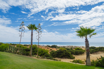 Sand dunes between hotels and beach of La Barrosa in Sancti Petri, Cadiz, Spain