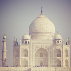 Amazing view on the Taj Mahal in sunset light with reflection in water. The Taj Mahal is an ivory-white marble mausoleum on the south bank of the Yamuna river. Agra, Uttar Pradesh, India.