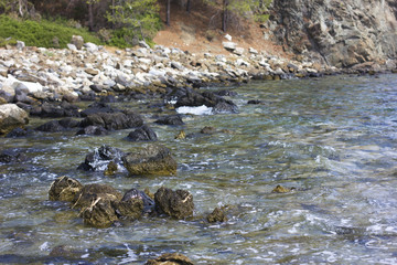 Stones on the beach at the sea under water