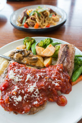 pork chop steak with red tomato sauce