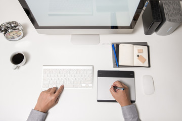 Man hand on computer keyboard on table top view