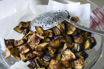Chopped and fried eggplant pieces for eggplant meal
