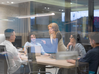 Startup Business Team At A Meeting at modern night office building