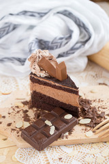 chocolate cake slice with chocolate cream and chocolate bar. cake background concept