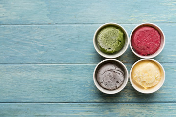 Top view of Ice cream flavors in cup and topping, sweet and dessert food concept