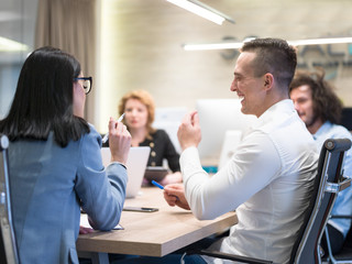 Startup Business Team At A Meeting at modern office building