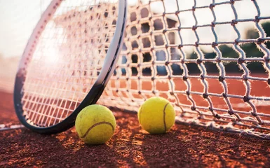 Badkamer foto achterwand Tennis ball with racket on the tennis court. Sport, recreation concept © bobex73