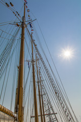 Low Angle View of Tallship Masts Against Clear Sky and Sun
