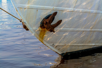 Close Up View of Moored Ship Stern With Water Reflections