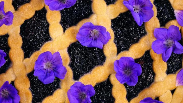 Cake With Spotted Crane's Bill Flowers (Geranium Maculatum) And Berry Filling. Extreme Closeup Top View Shot In 4K. 
