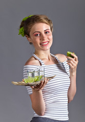 Beautiful woman with glasses of tequila .