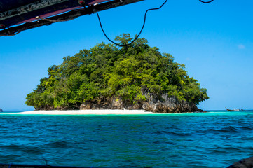 Scenics View of Tropical Island from Boat Against Sea and Blue Sky