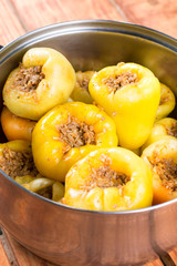 Stuffed fresh yellow paprika with minced meat with onions and rice
